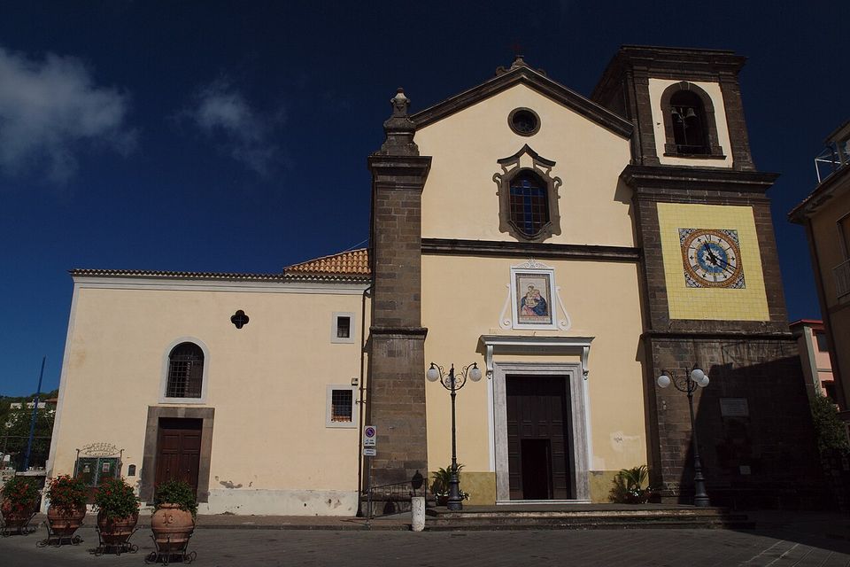 The church of Santa Maria delle Grazie, its bell tower and the small square in Sant’Agata sui Due Golfi.